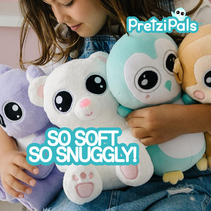 Girl hugging PretziPals plushies — so soft so snuggly